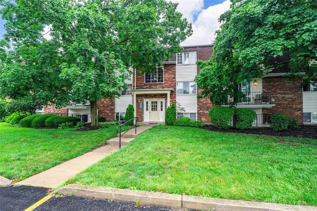 8869 Washington Colony Dr, Dayton, OH 45458 - view of front of property with brick siding and a front lawn
