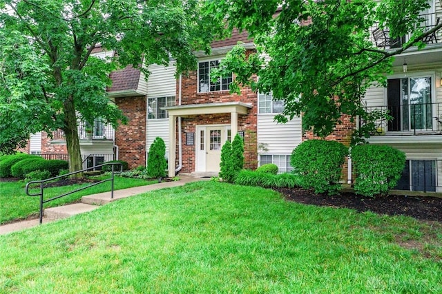 8869 Washington Colony Dr, Dayton, OH 45458 - view of front of home with a front lawn and brick siding