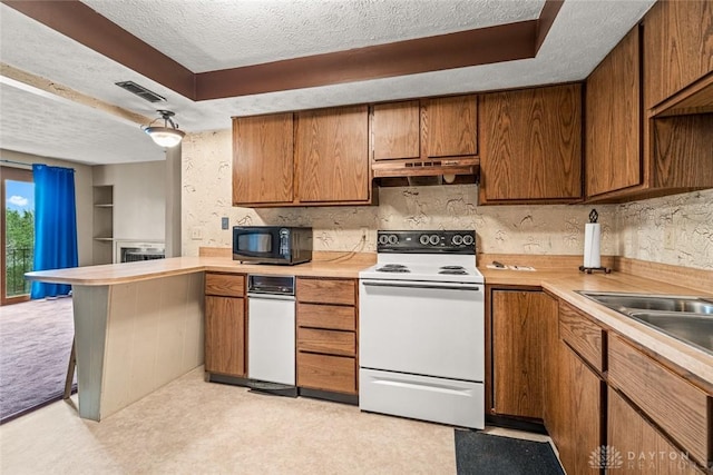 8869 Washington Colony Dr, Dayton, OH 45458 - kitchen with white electric range, black microwave, a textured ceiling, a peninsula, and under cabinet range hood