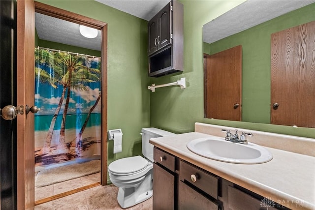 8869 Washington Colony Dr, Dayton, OH 45458 - full bath featuring vanity, a textured ceiling, and tile patterned floors
