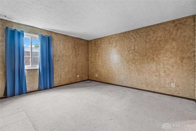 8869 Washington Colony Dr, Dayton, OH 45458 - carpeted spare room with baseboards and a textured ceiling