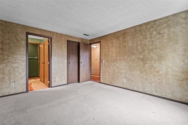 8869 Washington Colony Dr, Dayton, OH 45458 - unfurnished bedroom featuring carpet floors, ensuite bath, and a closet