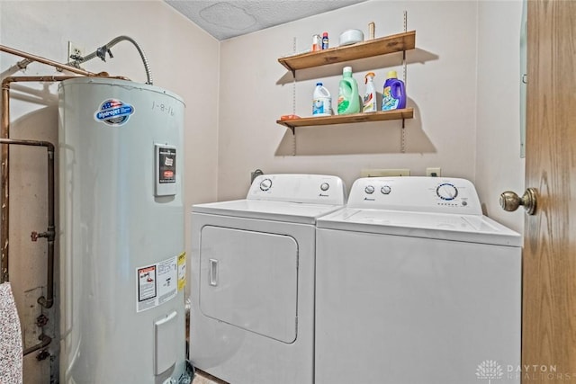 8869 Washington Colony Dr, Dayton, OH 45458 - laundry area with electric water heater, independent washer and dryer, and a textured ceiling