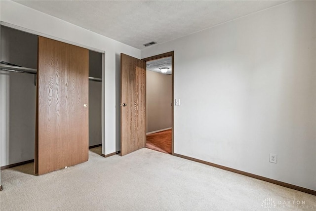8869 Washington Colony Dr, Dayton, OH 45458 - unfurnished bedroom with carpet flooring and a closet