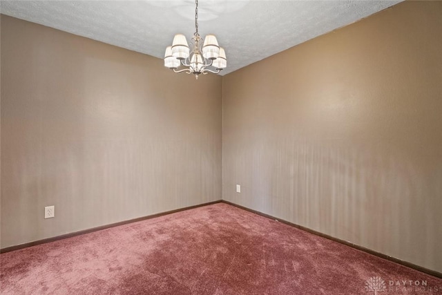 8869 Washington Colony Dr, Dayton, OH 45458 - carpeted empty room featuring a chandelier and a textured ceiling