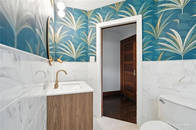 38-40 Greenwood Ave, Dayton, OH 45410 - bathroom with wallpapered walls, tile walls, vanity, and a wainscoted wall