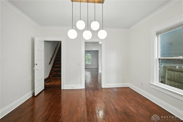 38-40 Greenwood Ave, Dayton, OH 45410 - spare room featuring hardwood / wood-style flooring, ornamental molding, and stairway
