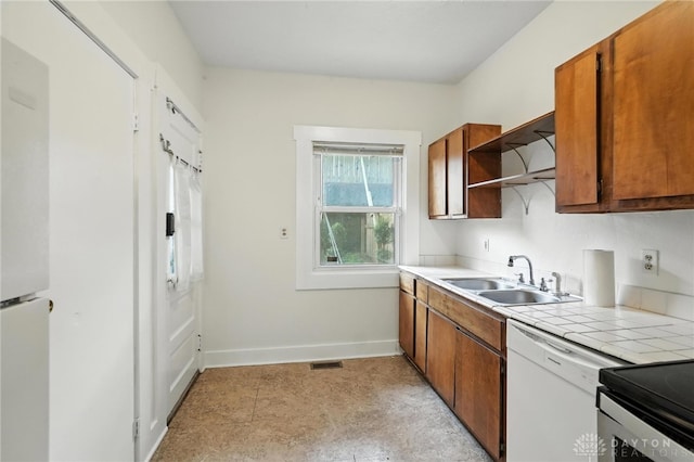 38-40 Greenwood Ave, Dayton, OH 45410 - kitchen featuring white dishwasher, open shelves, tile counters, and brown cabinetry