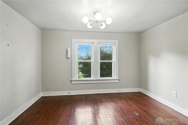 38-40 Greenwood Ave, Dayton, OH 45410 - spare room featuring wood-type flooring and a chandelier