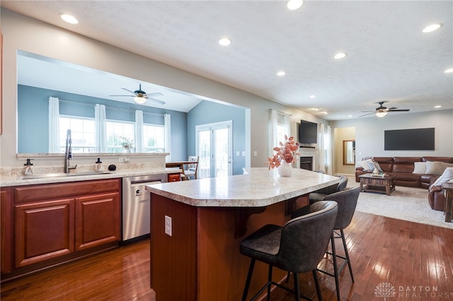 2937 E Ambrosia Ln, Xenia, OH 45385 - kitchen featuring a ceiling fan, dishwasher, a kitchen bar, light countertops, and recessed lighting