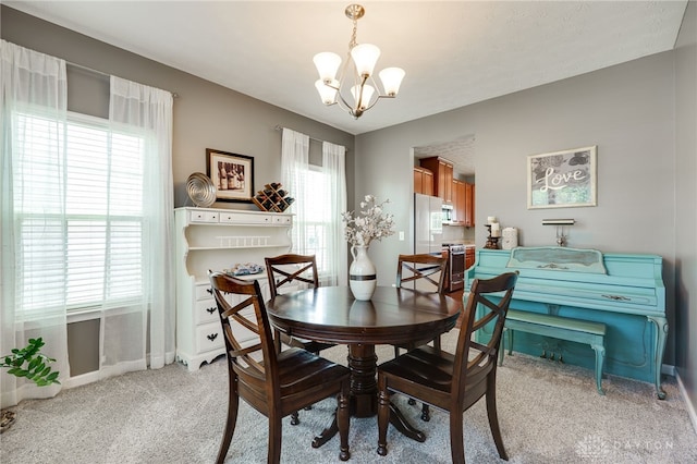 2937 E Ambrosia Ln, Xenia, OH 45385 - dining room with a chandelier and light colored carpet