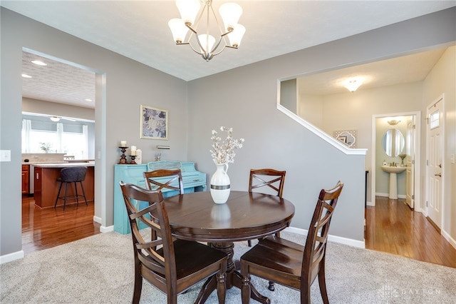 2937 E Ambrosia Ln, Xenia, OH 45385 - dining space with light carpet, a chandelier, and recessed lighting