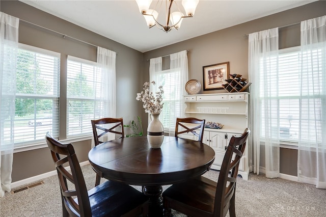 2937 E Ambrosia Ln, Xenia, OH 45385 - dining area with plenty of natural light, a chandelier, and light colored carpet