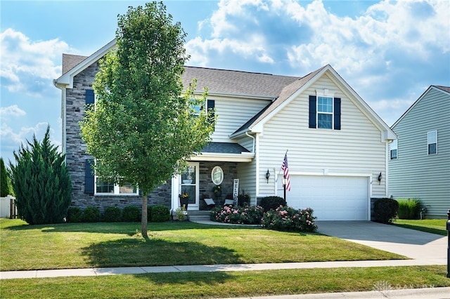 2937 E Ambrosia Ln, Xenia, OH 45385 - traditional-style house featuring stone siding, an attached garage, a front yard, and driveway