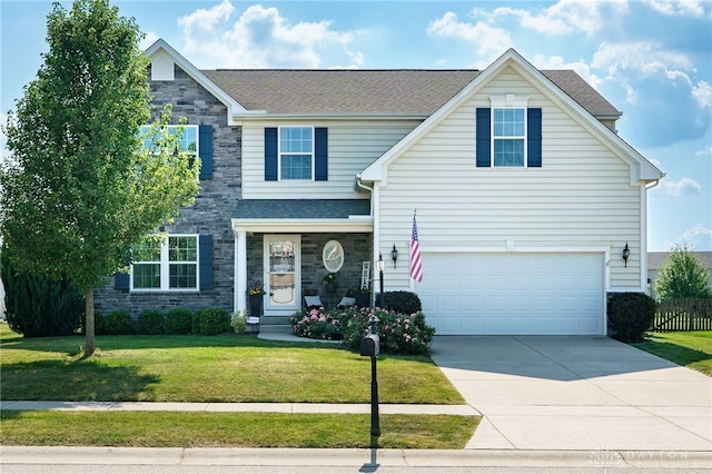 2937 E Ambrosia Ln, Xenia, OH 45385 - traditional home featuring stone siding, a front yard, an attached garage, and driveway