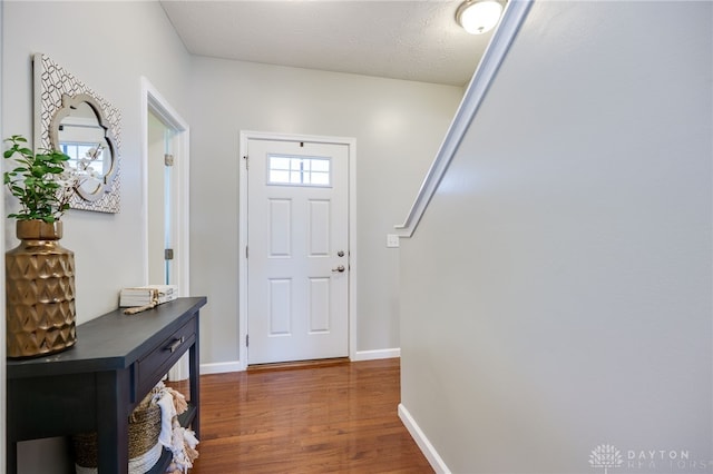 2937 E Ambrosia Ln, Xenia, OH 45385 - foyer entrance featuring dark wood-style flooring and a textured ceiling