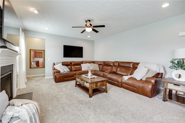 2937 E Ambrosia Ln, Xenia, OH 45385 - carpeted living area featuring ceiling fan, a fireplace, and recessed lighting