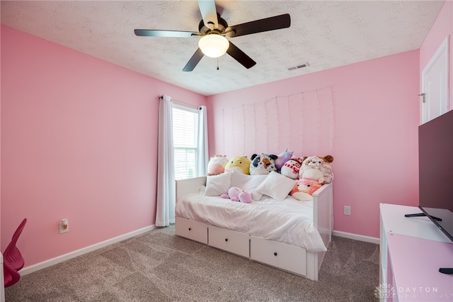 2937 E Ambrosia Ln, Xenia, OH 45385 - bedroom featuring carpet floors, a ceiling fan, and a textured ceiling