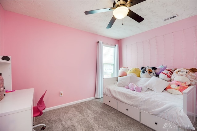 2937 E Ambrosia Ln, Xenia, OH 45385 - bedroom with light carpet, ceiling fan, and a textured ceiling