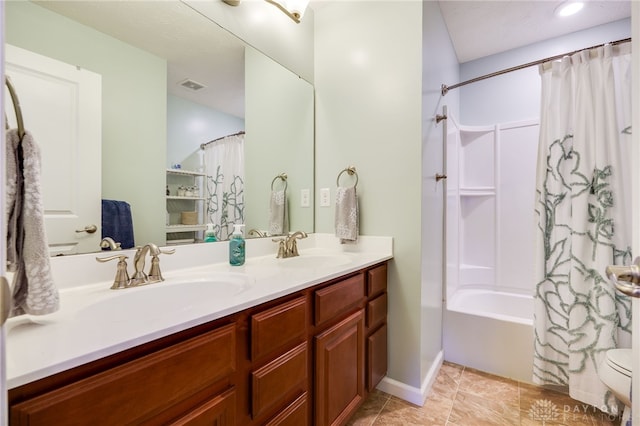 2937 E Ambrosia Ln, Xenia, OH 45385 - full bathroom featuring double vanity, shower / bath combo, and tile patterned floors