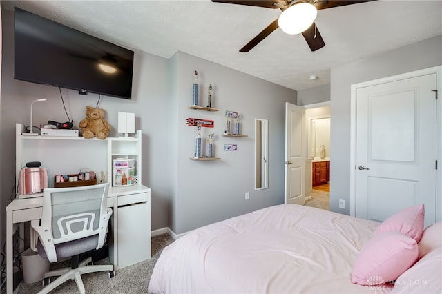 2937 E Ambrosia Ln, Xenia, OH 45385 - bedroom with light colored carpet, connected bathroom, and a ceiling fan