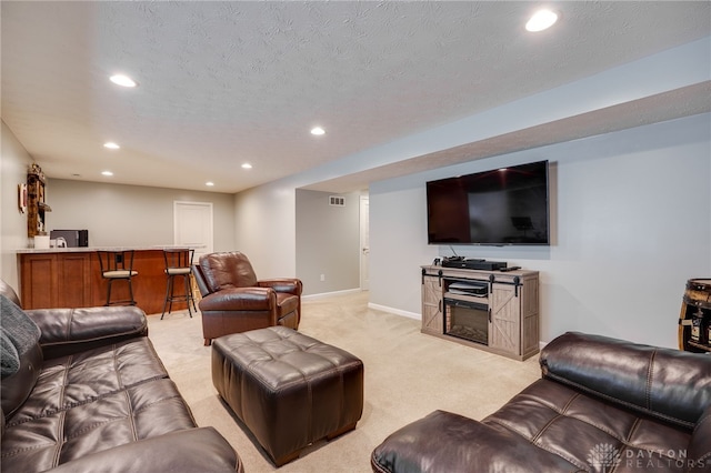 2937 E Ambrosia Ln, Xenia, OH 45385 - living area featuring recessed lighting, light colored carpet, and a textured ceiling