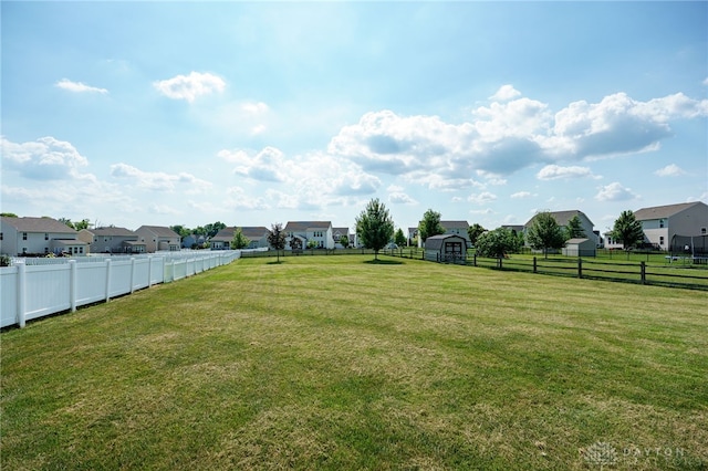 2937 E Ambrosia Ln, Xenia, OH 45385 - fenced backyard with a storage unit and a residential view
