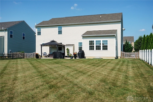 2937 E Ambrosia Ln, Xenia, OH 45385 - rear view of house featuring a gazebo, a fenced backyard, a patio, and a gate