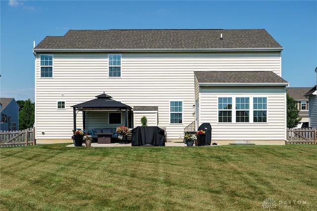 2937 E Ambrosia Ln, Xenia, OH 45385 - rear view of house with an outdoor living space, a patio, a gazebo, and a fenced backyard