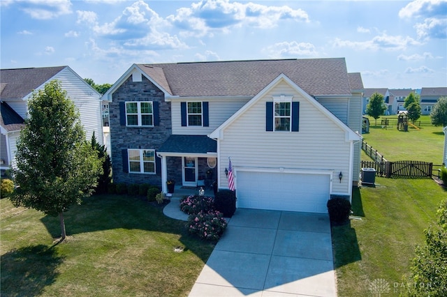 2937 E Ambrosia Ln, Xenia, OH 45385 - traditional-style house with an attached garage, driveway, and stone siding