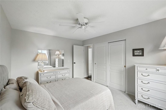 7793 Birchwood Ct, Mason, OH 45040 - bedroom featuring a closet, light colored carpet, and a ceiling fan