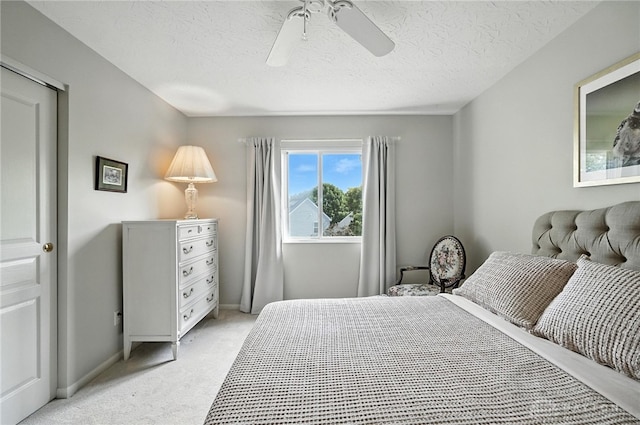 7793 Birchwood Ct, Mason, OH 45040 - bedroom featuring light colored carpet, a ceiling fan, and a textured ceiling