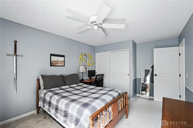 7793 Birchwood Ct, Mason, OH 45040 - bedroom featuring a closet, ceiling fan, and a textured ceiling