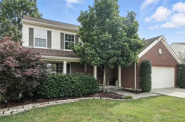 7793 Birchwood Ct, Mason, OH 45040 - view of front facade with an attached garage, a front yard, concrete driveway, and brick siding