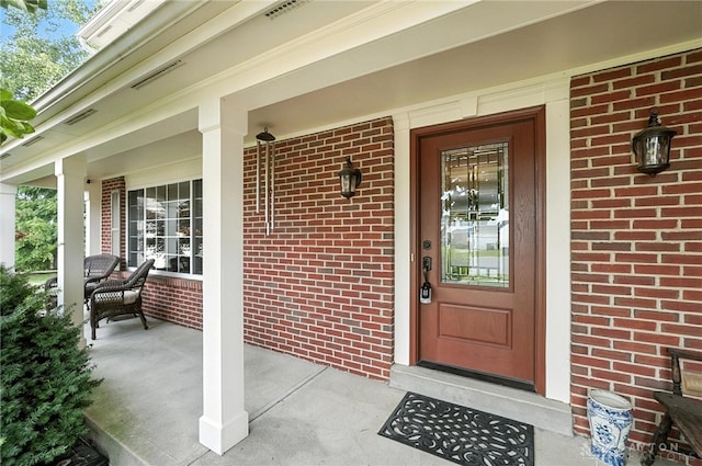 7793 Birchwood Ct, Mason, OH 45040 - entrance to property with a porch and brick siding