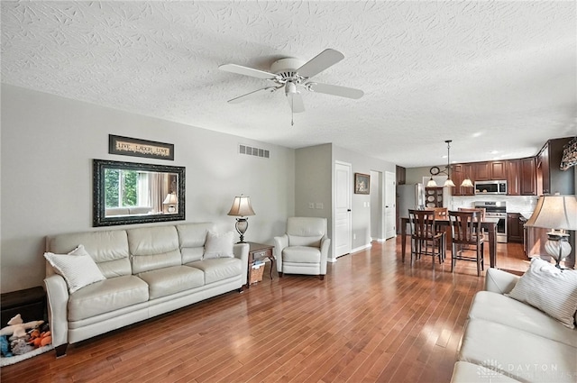 7793 Birchwood Ct, Mason, OH 45040 - living room with ceiling fan, wood finished floors, and a textured ceiling