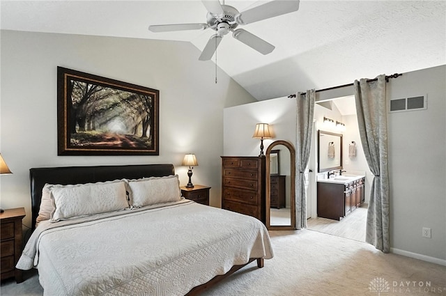 7793 Birchwood Ct, Mason, OH 45040 - bedroom featuring light colored carpet, vaulted ceiling, ensuite bath, and a ceiling fan