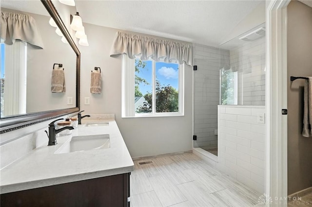 7793 Birchwood Ct, Mason, OH 45040 - bathroom featuring double vanity and tiled shower