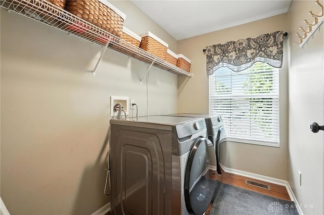 7793 Birchwood Ct, Mason, OH 45040 - washroom featuring independent washer and dryer and wood finished floors