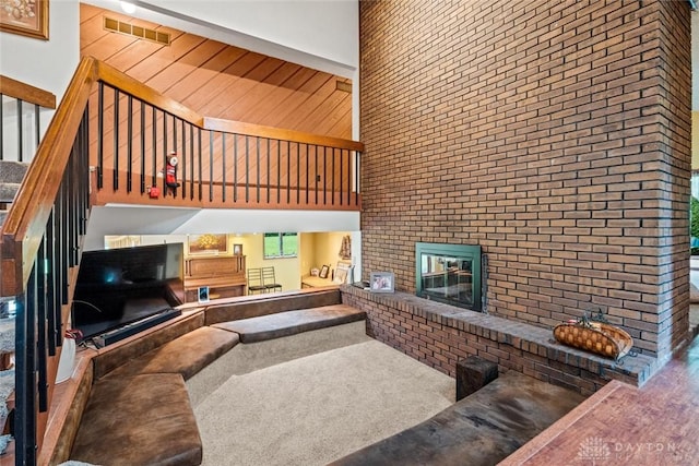 4230 Wagner Rd, Dayton, OH 45440 - carpeted living room with a towering ceiling and a fireplace