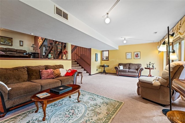 4230 Wagner Rd, Dayton, OH 45440 - living room featuring carpet flooring, stairs, and track lighting