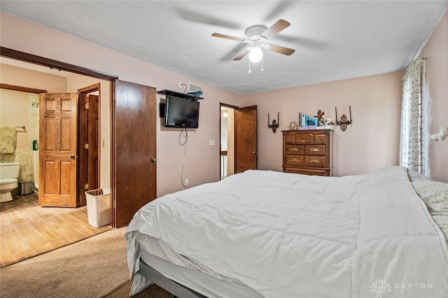 4230 Wagner Rd, Dayton, OH 45440 - bedroom with carpet flooring, ensuite bathroom, ceiling fan, and wood finished floors