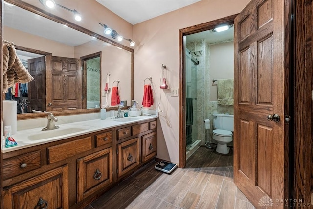 4230 Wagner Rd, Dayton, OH 45440 - full bath with a stall shower, double vanity, and wood finish floors