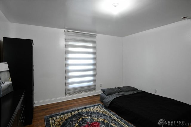 719 N Keowee St, Dayton, OH 45404 - bedroom with wood finished floors and baseboards