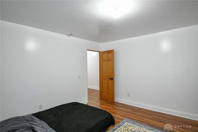 719 N Keowee St, Dayton, OH 45404 - bedroom featuring wood finished floors and baseboards