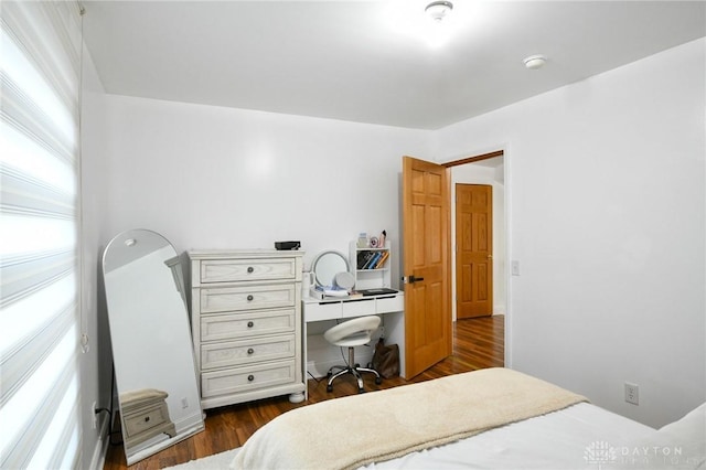 719 N Keowee St, Dayton, OH 45404 - bedroom with multiple windows and dark wood-style floors