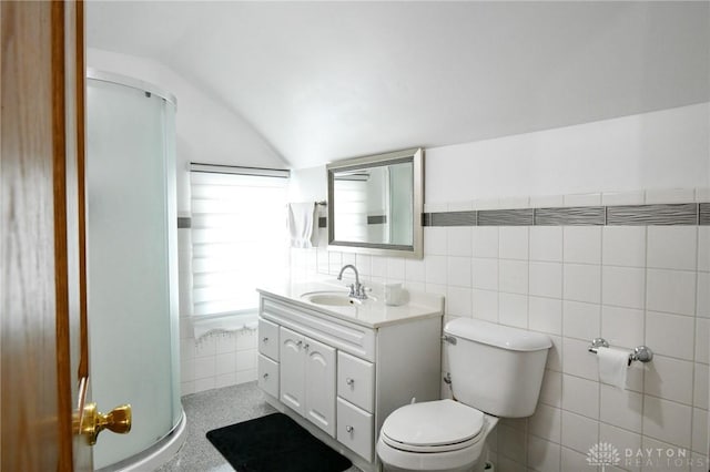 719 N Keowee St, Dayton, OH 45404 - full bath with tile walls, vaulted ceiling, vanity, and a stall shower