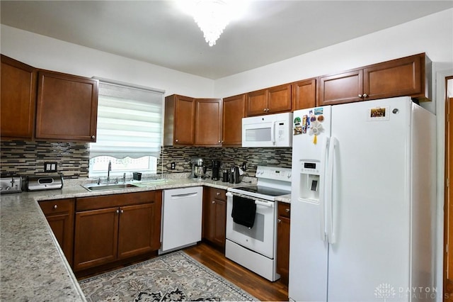 719 N Keowee St, Dayton, OH 45404 - kitchen featuring white appliances, decorative backsplash, dark wood finished floors, and light stone countertops