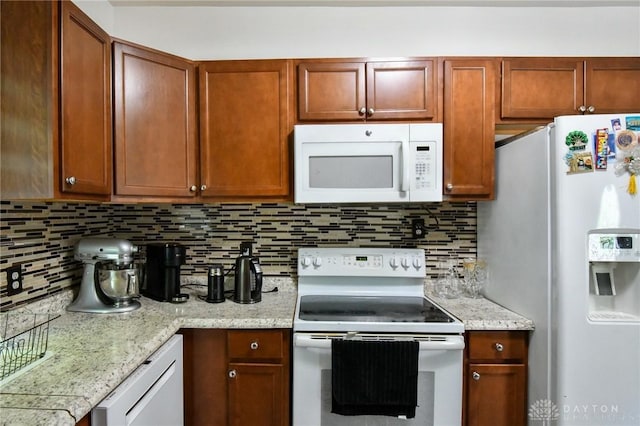 719 N Keowee St, Dayton, OH 45404 - kitchen with white appliances and tasteful backsplash