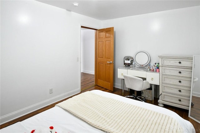 719 N Keowee St, Dayton, OH 45404 - bedroom featuring wood finished floors and a desk